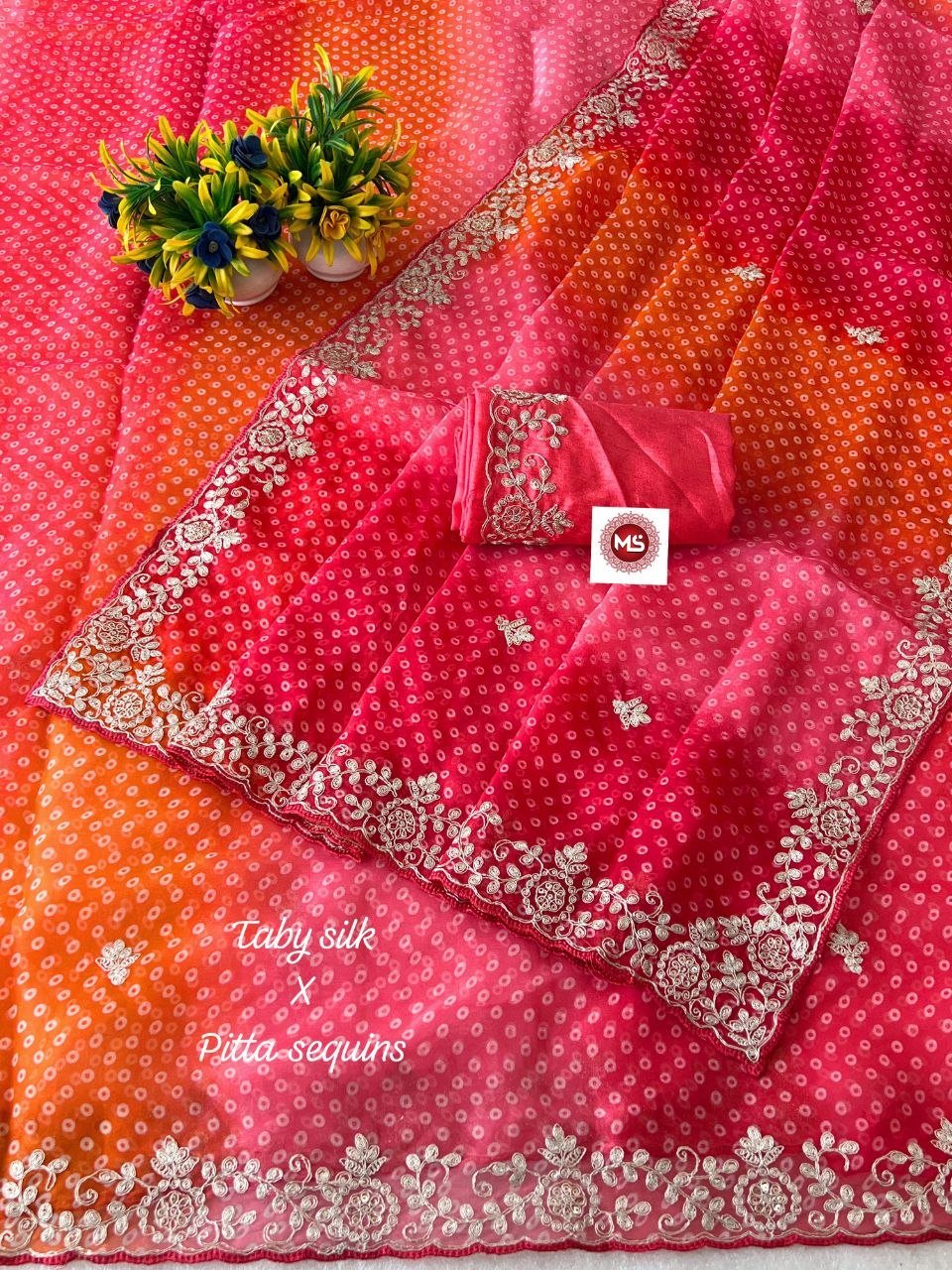 Pink Bandhani Taby Silk Saree with Pitta Work 4 A beautiful pink Bandhani Taby silk saree with intricate gold pitta work borders and a matching blouse.