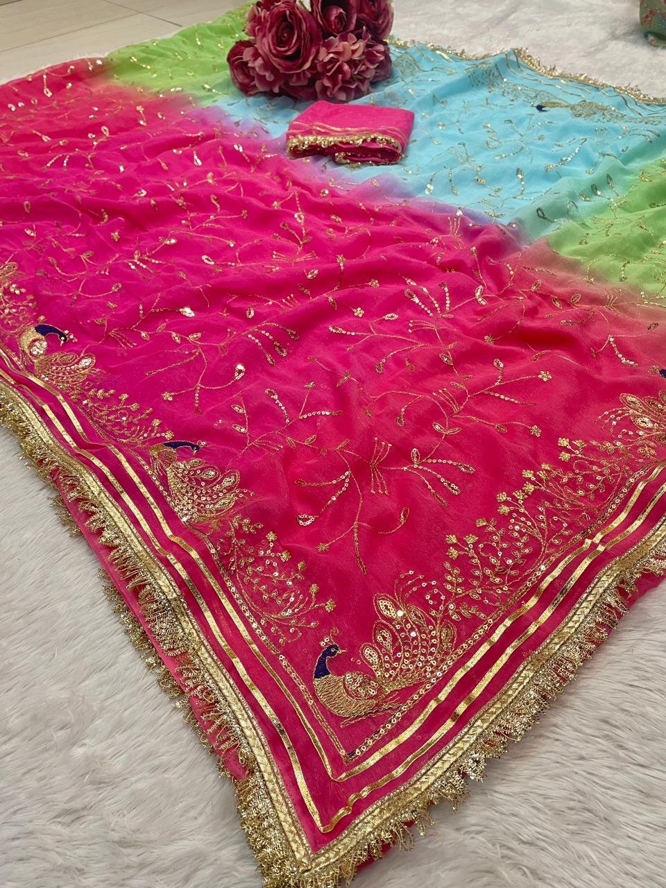 Multi-Color Chiffon Shimar Gotapatti Saree 2 A beautiful multi-color Chiffon Shimar saree with detailed gold jaal embroidery and a traditional Gota Patti border.