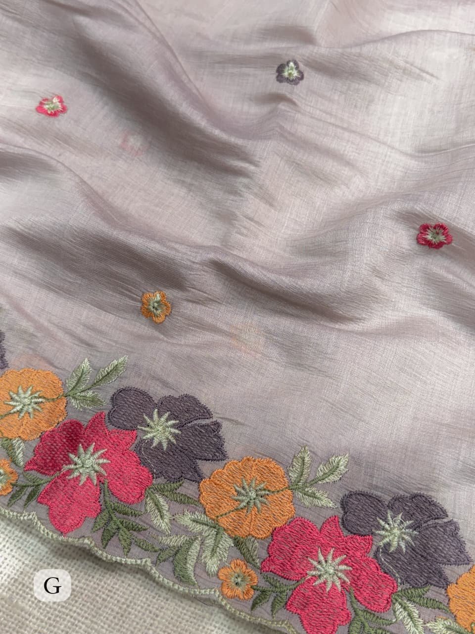 Coral Chiffon Saree with Kashmiri Thread Embroidery 9 A collage showing multiple views of a coral chiffon saree with intricate multi-colored floral embroidery and scalloped border details.