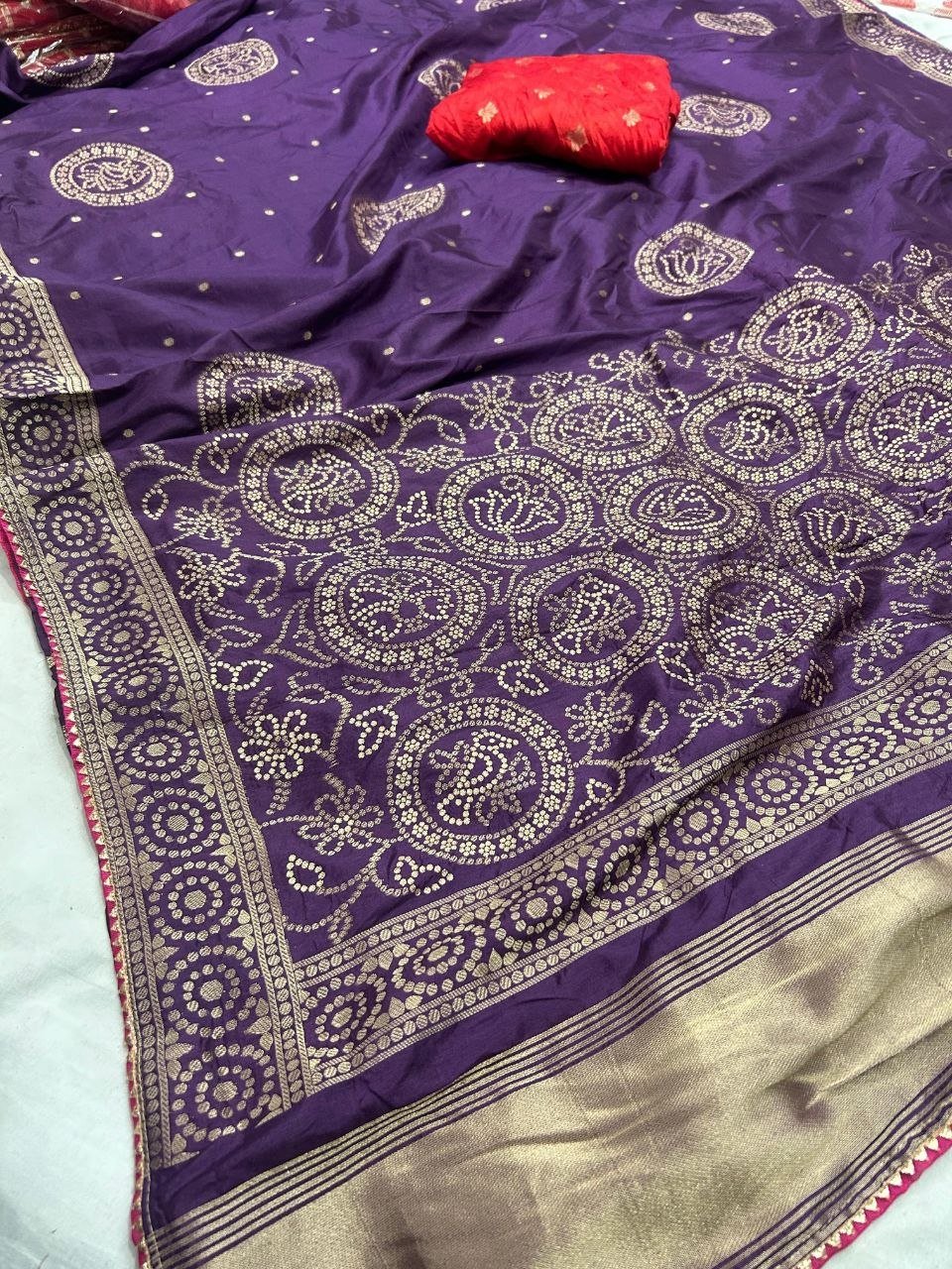 Deep Purple Dola Silk Zari Work Saree | Kanha Saree 6 A flat-lay view of a deep purple Dola silk saree featuring gold zari work and a contrasting red blouse piece.