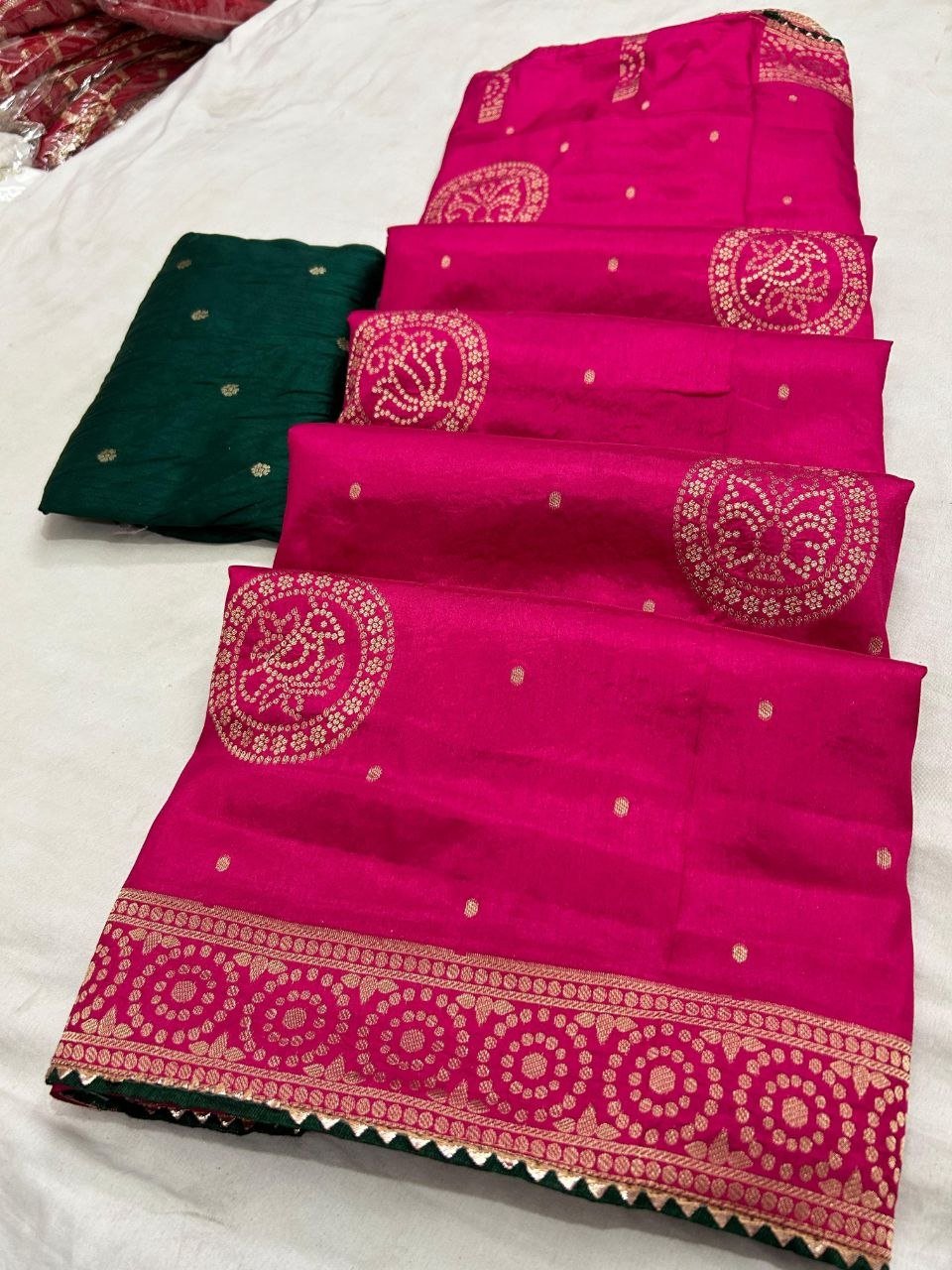 Deep Purple Dola Silk Zari Work Saree | Kanha Saree 8 A flat-lay view of a deep purple Dola silk saree featuring gold zari work and a contrasting red blouse piece.