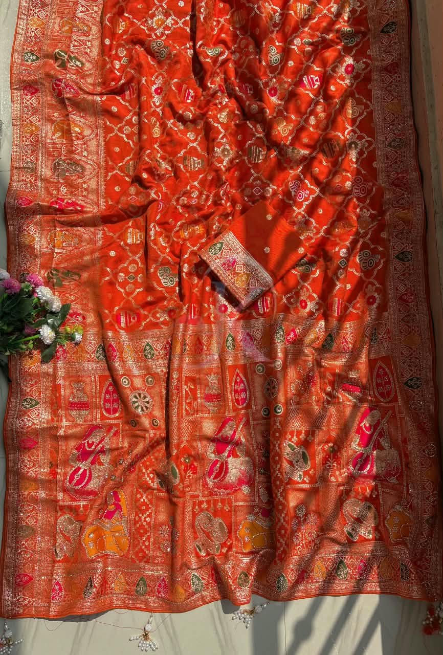 Dola Viscose Weaving Saree with Meenakari Pallu 1 A vibrant red and rani Dola Viscose saree with intricate Meenakari weaving, heavy Jarkhan work, and a rich decorative pallu.