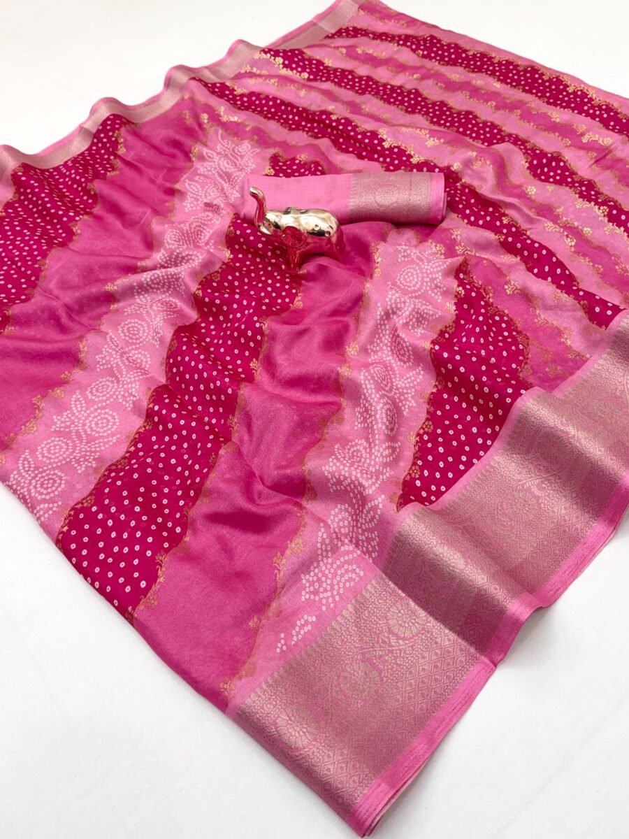 A vibrant pink Dolla silk saree with a traditional Leheriya pattern and metallic zari border, paired with a matching zari ikkat blouse.