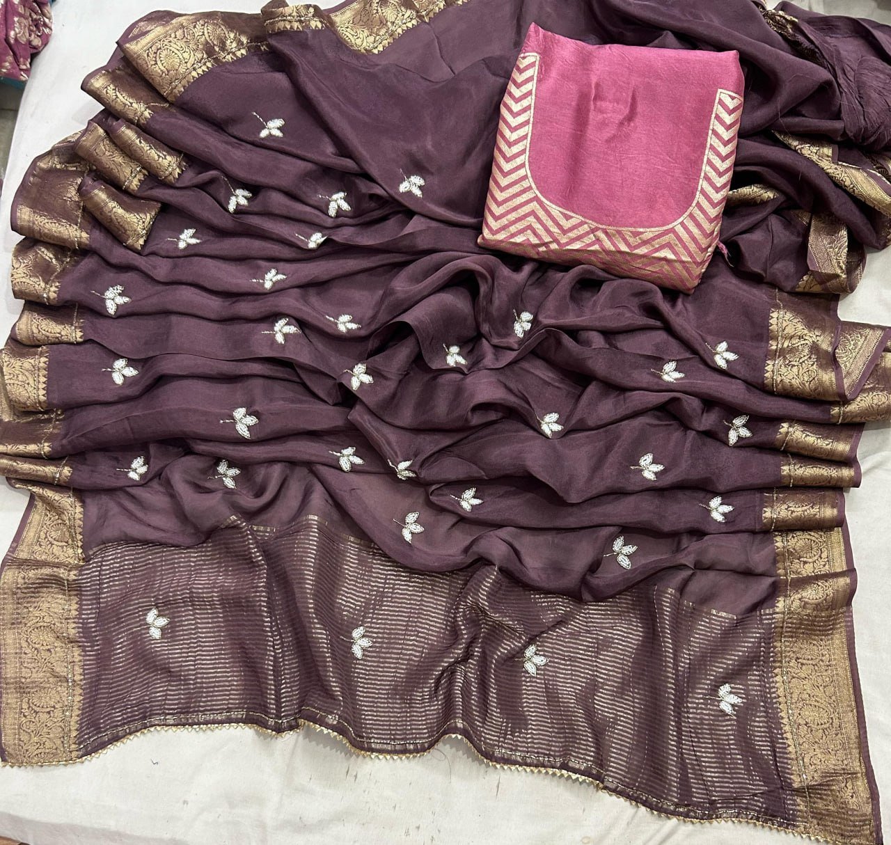 H.O. Silk Saree with Elegant Zari Border 4 A luxurious H.O. Silk saree in a deep red shade with intricate embroidery and a traditional zari border.