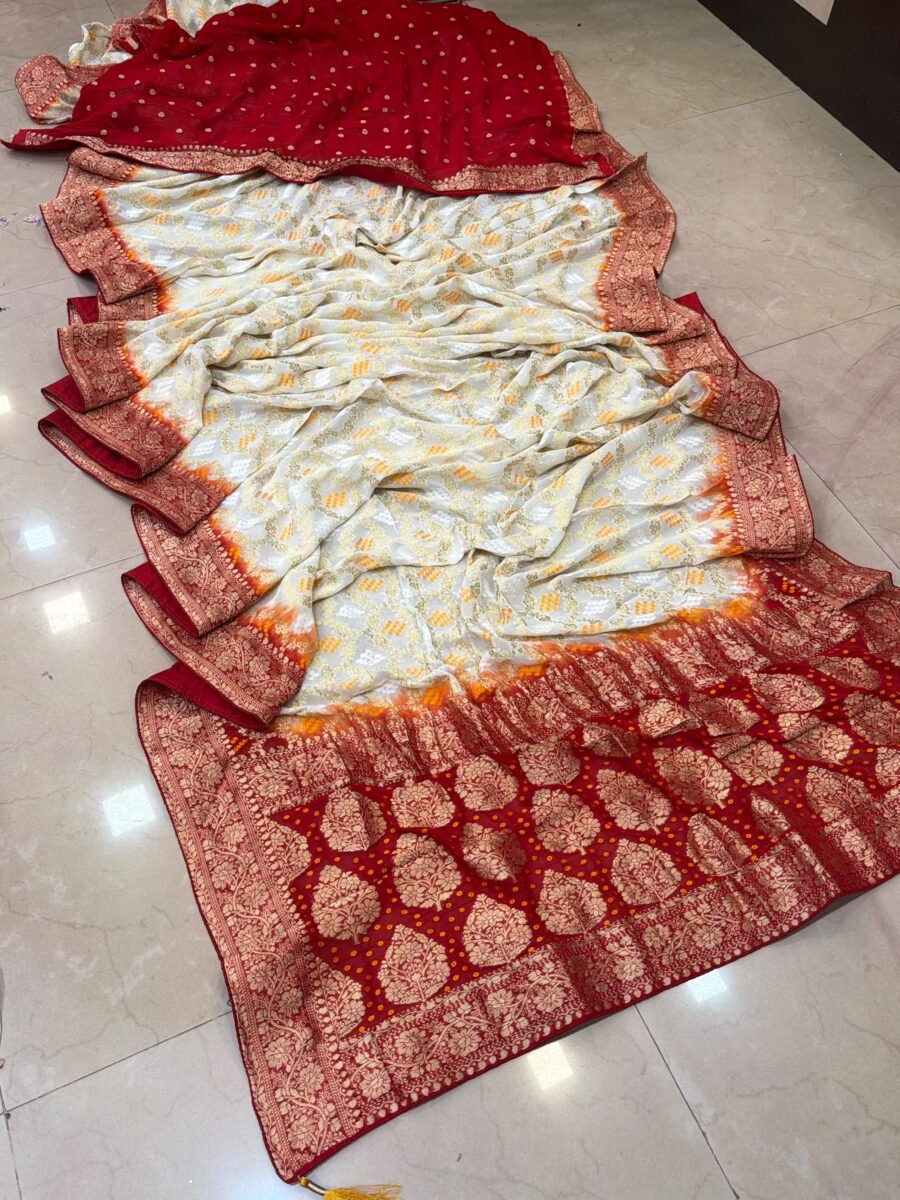 A beautiful white and red Pure Khadi Jorjett saree with intricate Meena Zari embroidery displayed on a tiled floor.
