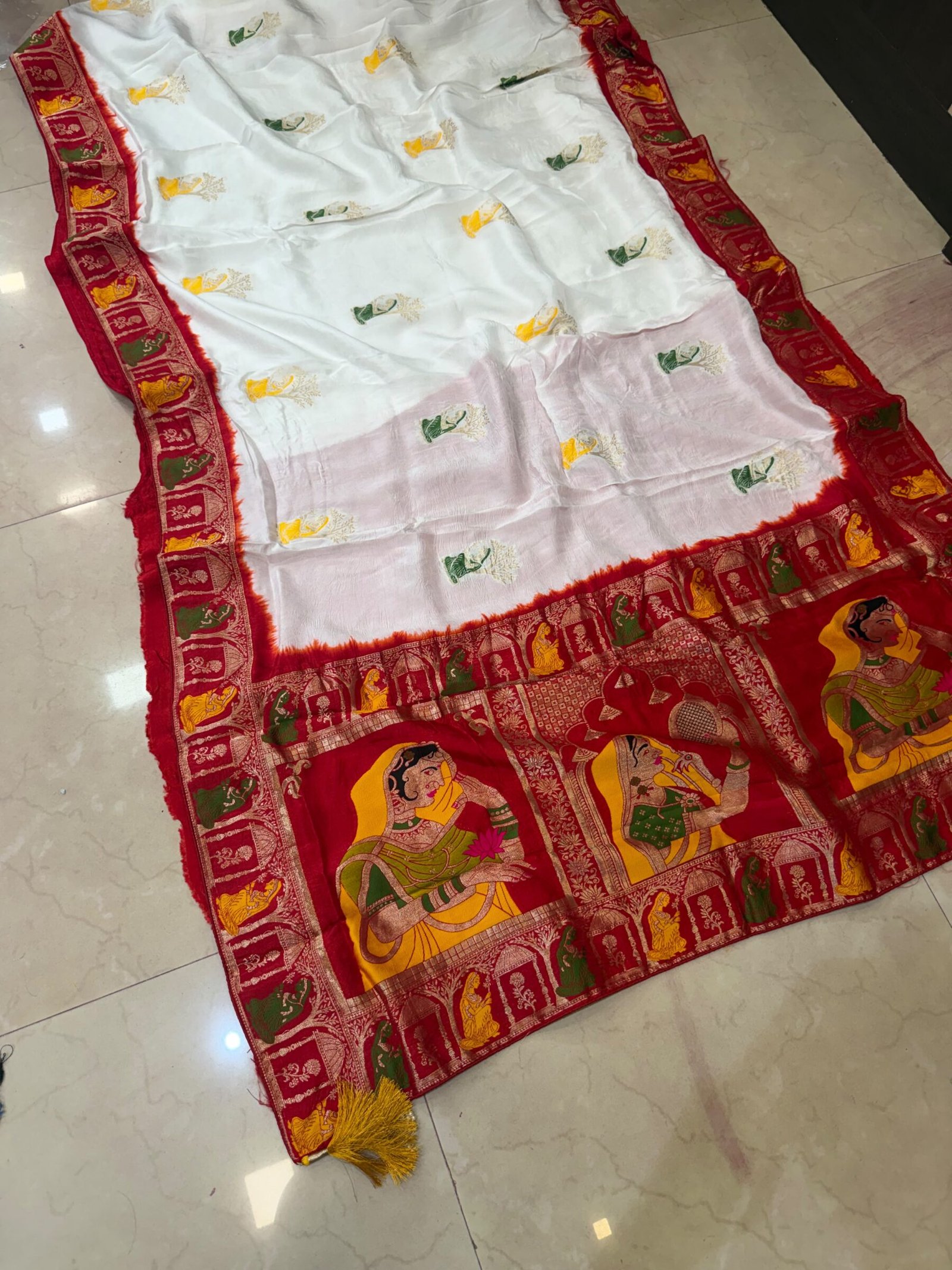 Pure Moonga Silk Banarasi Saree for Karwa Chauth 4 A beautiful bright yellow pure moonga silk banarasi saree with a contrasting red border featuring detailed traditional weaving work.