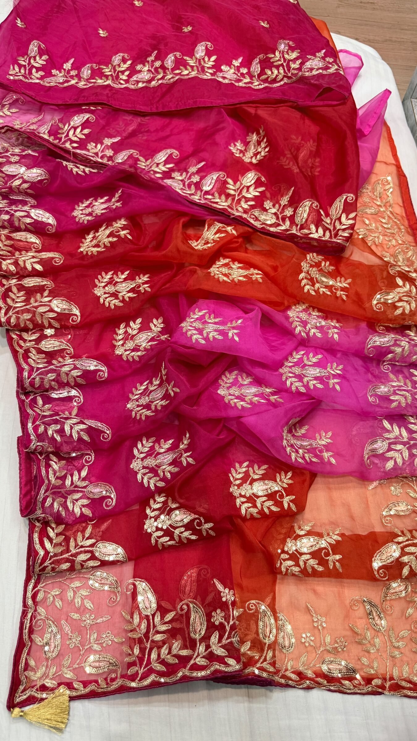 Pure Organza Gota Patti Saree | Designer Ethnic Wear 2 A beautiful yellow and orange shaded pure organza saree adorned with intricate silver Gota Patti work and floral motifs.