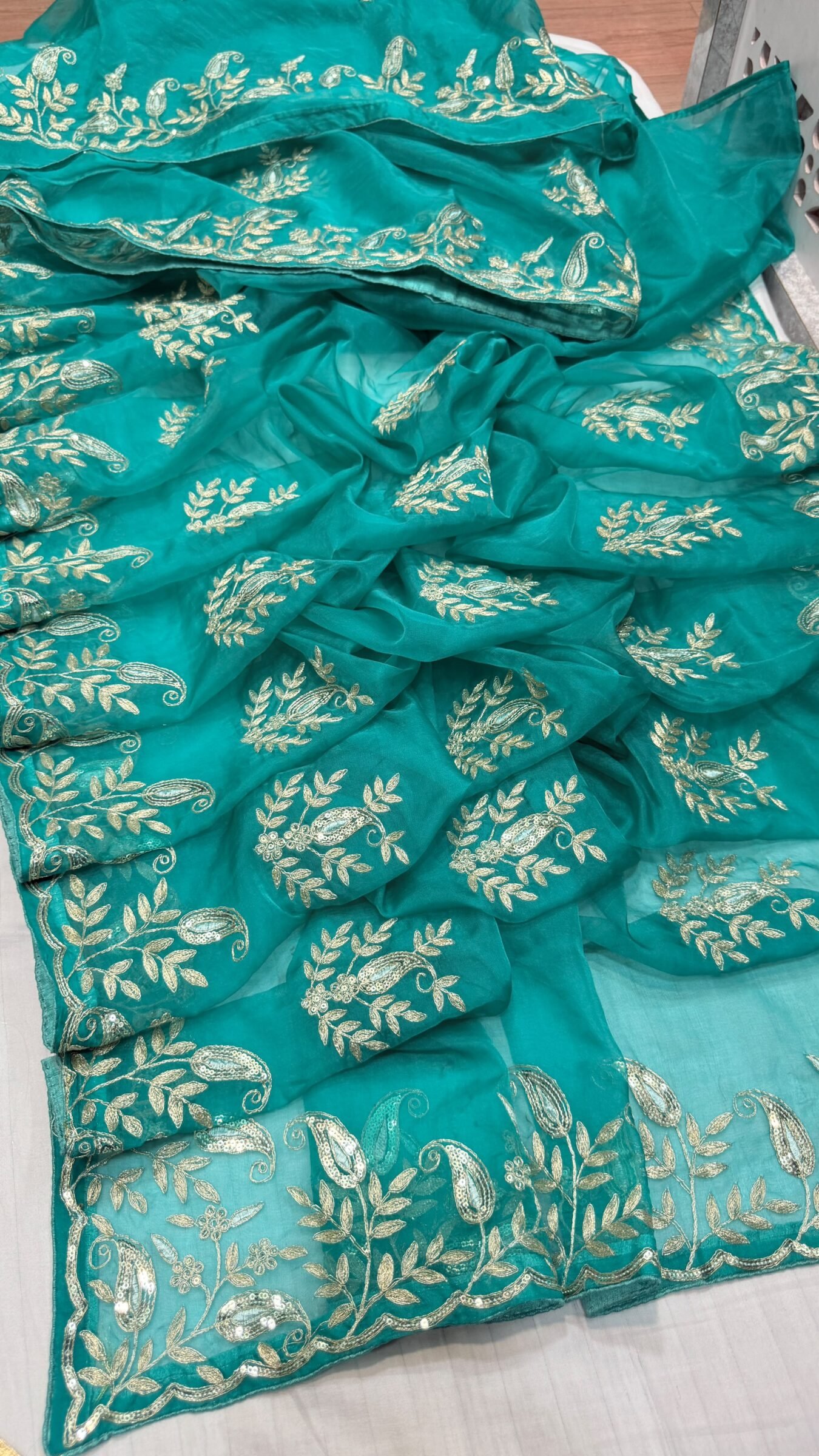 Pure Organza Gota Patti Saree | Designer Ethnic Wear 3 A beautiful yellow and orange shaded pure organza saree adorned with intricate silver Gota Patti work and floral motifs.