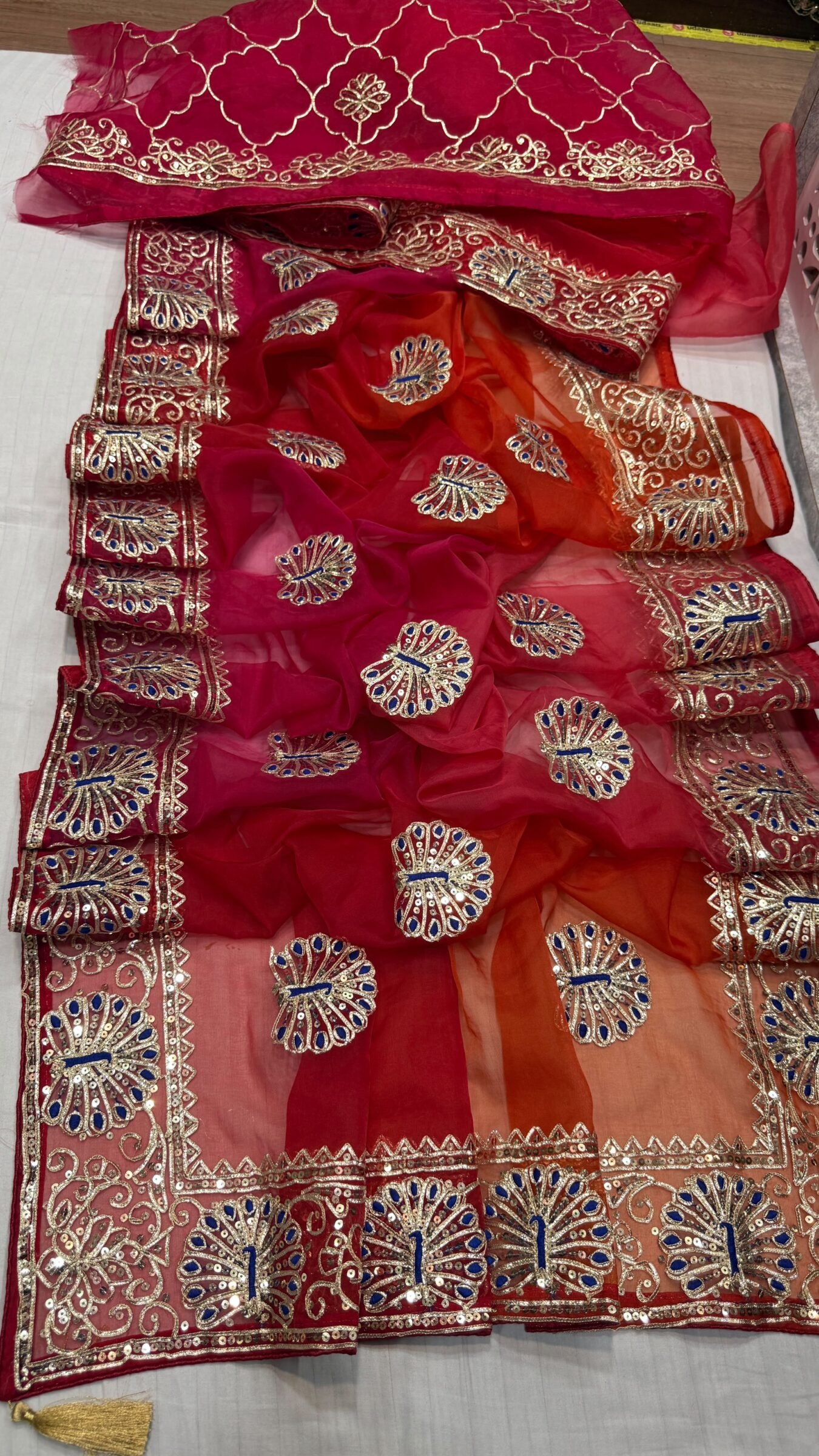 Pure Organza Gota Patti Saree | Designer Ethnic Wear 4 A beautiful yellow and orange shaded pure organza saree adorned with intricate silver Gota Patti work and floral motifs.