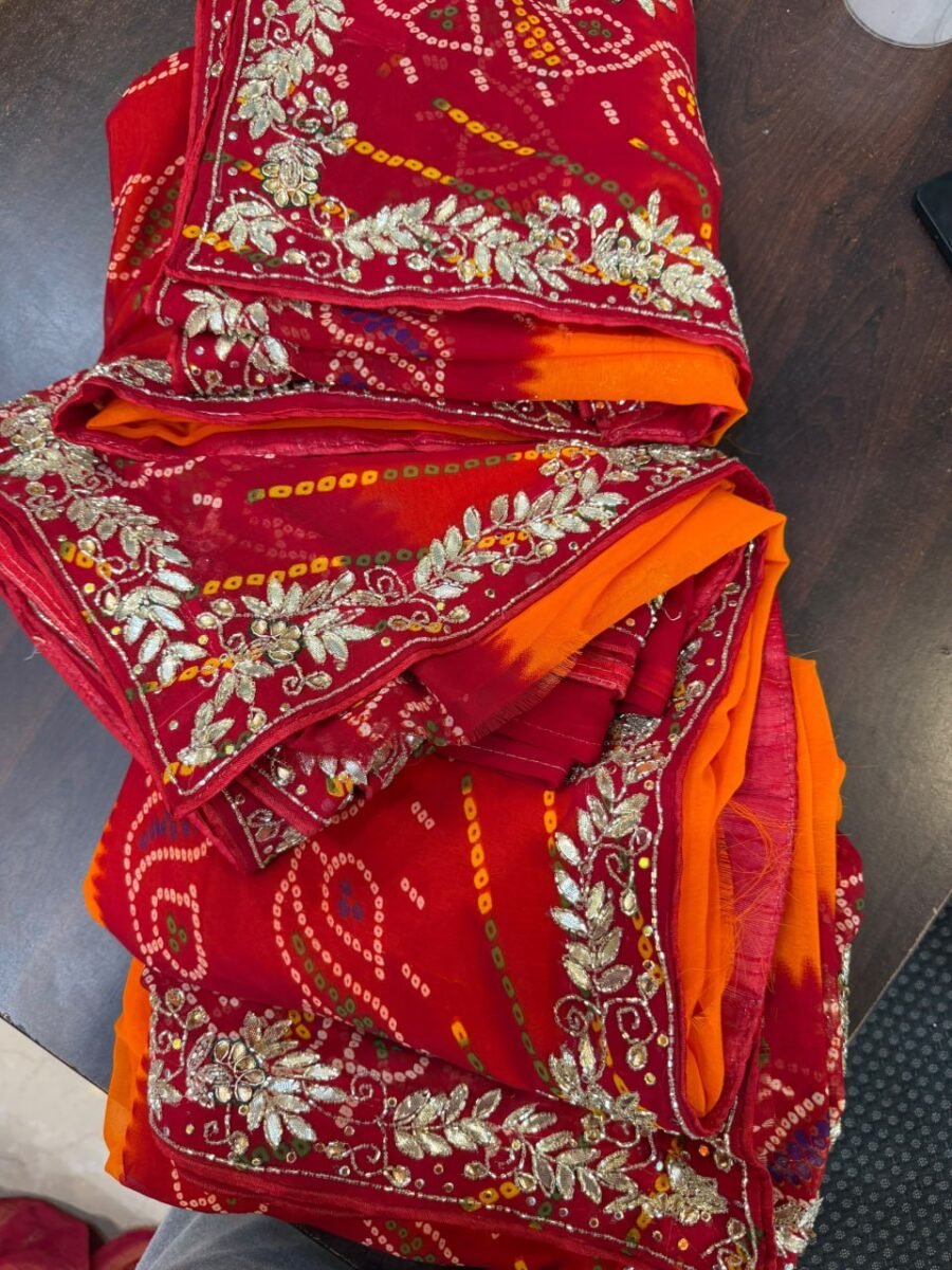 A vibrant yellow Piliya georgette saree featuring detailed hand-made gotta patti embroidery on the border.