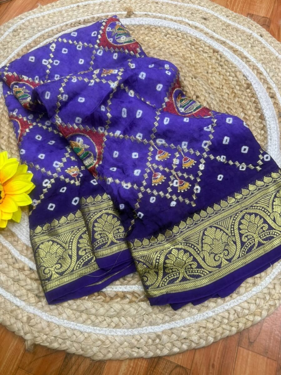A beautiful purple Bandhej saree in pure ATS silk featuring a heavy golden border and intricate traditional patterns.