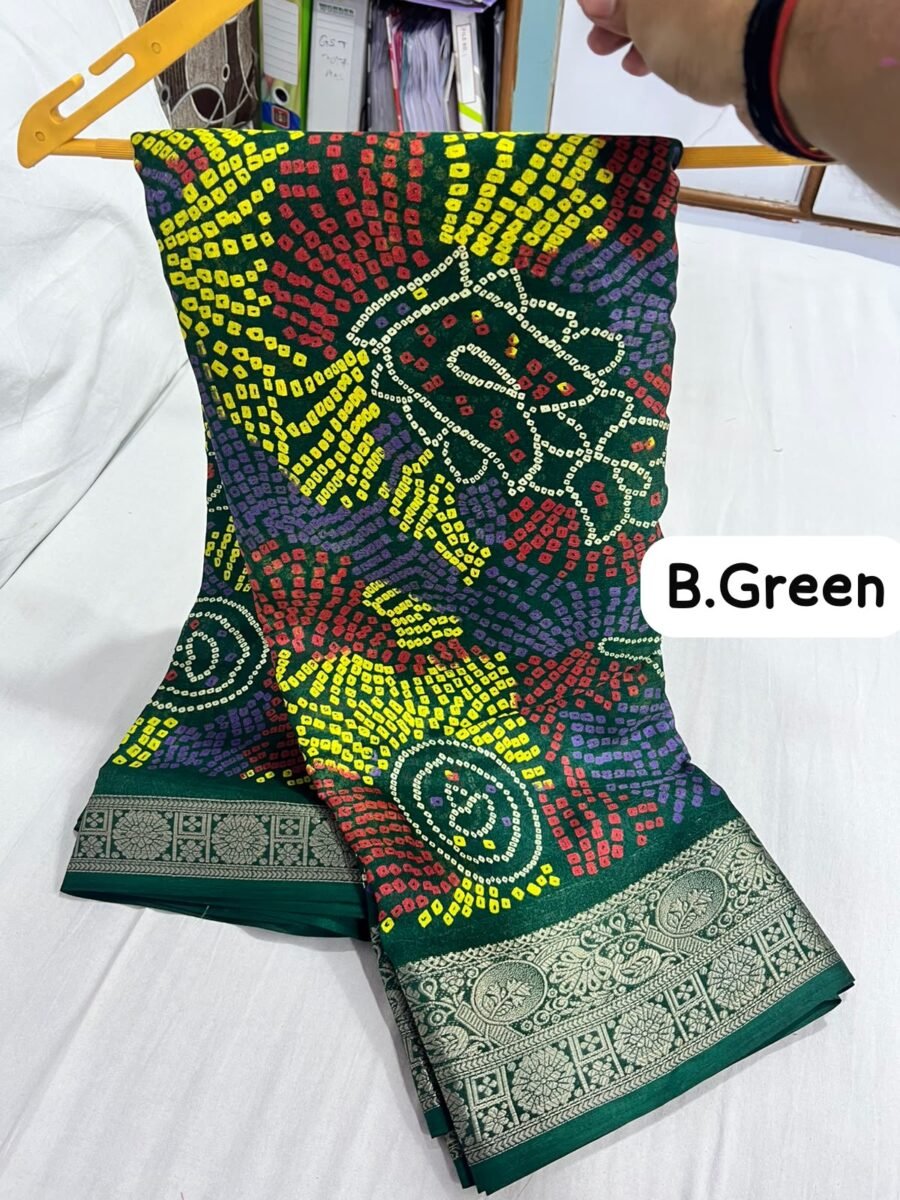 A close-up of a green Marshmellow saree with traditional Shekhawati Bandhej prints and detailed woven borders.