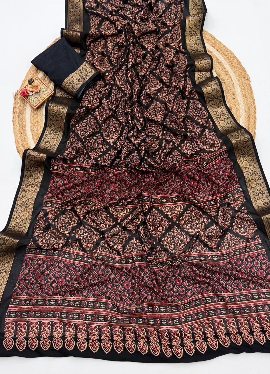 Soft Dola Weaving Saree with Jacquard Border 8 A navy blue Soft Dola weaving saree with an intricate golden jacquard border and a matching blouse piece on a jute mat.