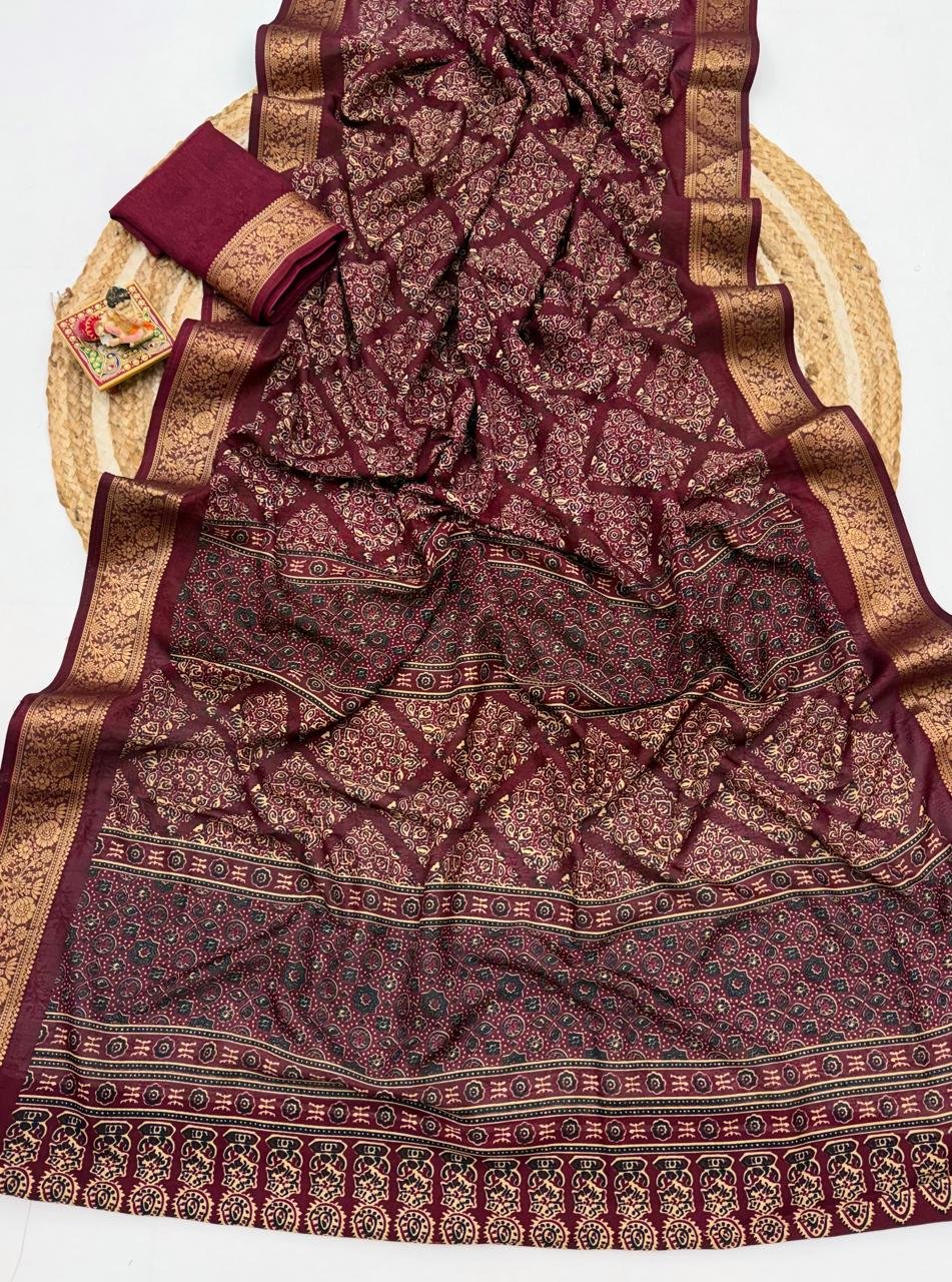 Soft Dola Weaving Saree with Jacquard Border 9 A navy blue Soft Dola weaving saree with an intricate golden jacquard border and a matching blouse piece on a jute mat.