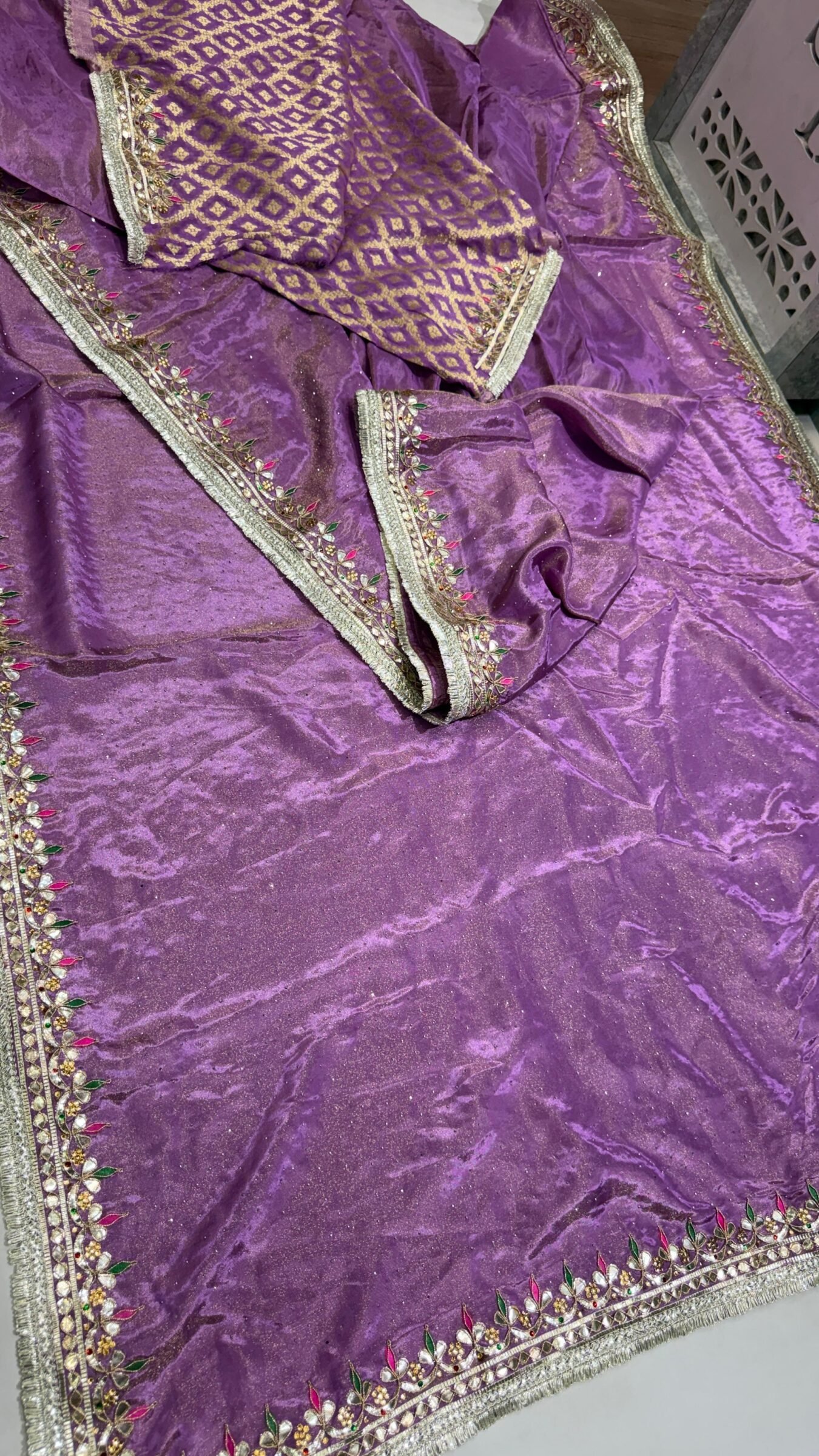 Pure Tissue Cosmos Silk Gota Patti Saree 1 A beautiful purple Pure Tissue Cosmos Silk saree with heavy gold Gota Patti work and a traditional Kiran border.