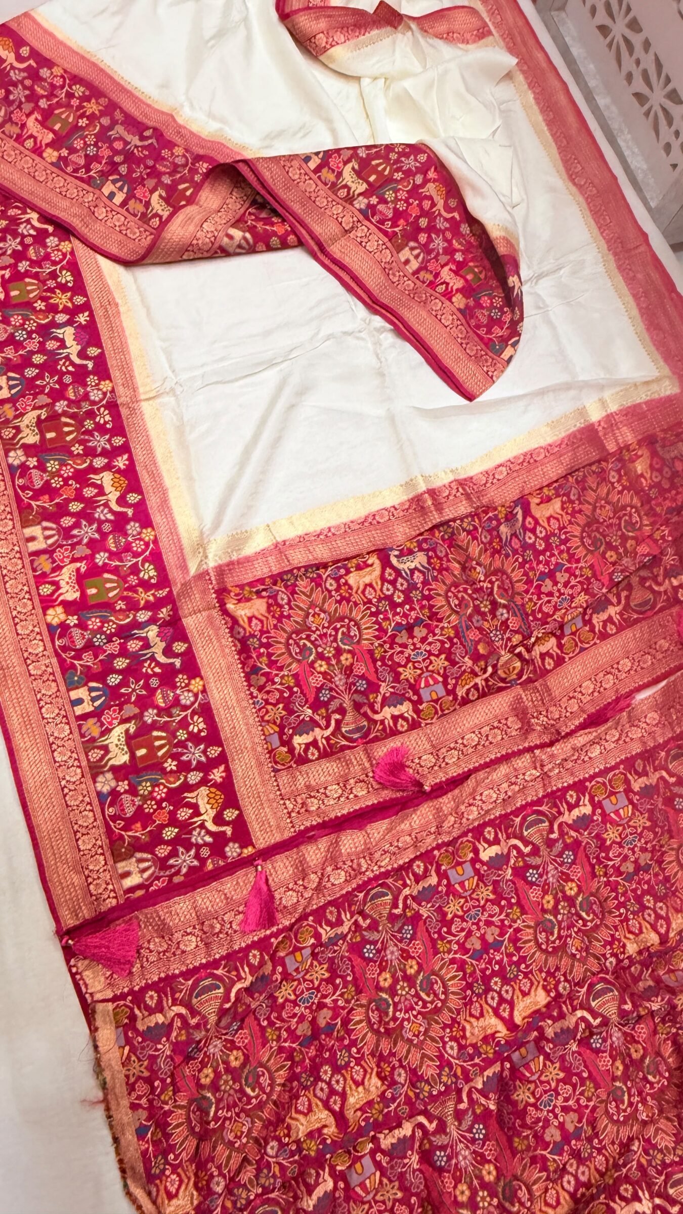Royal Raj Darbari Tissue Silk Saree with Zari Work 10 A beautiful teal tissue silk saree featuring intricate golden zari work, traditional raj darbari motifs, and a matching embroidered blouse.