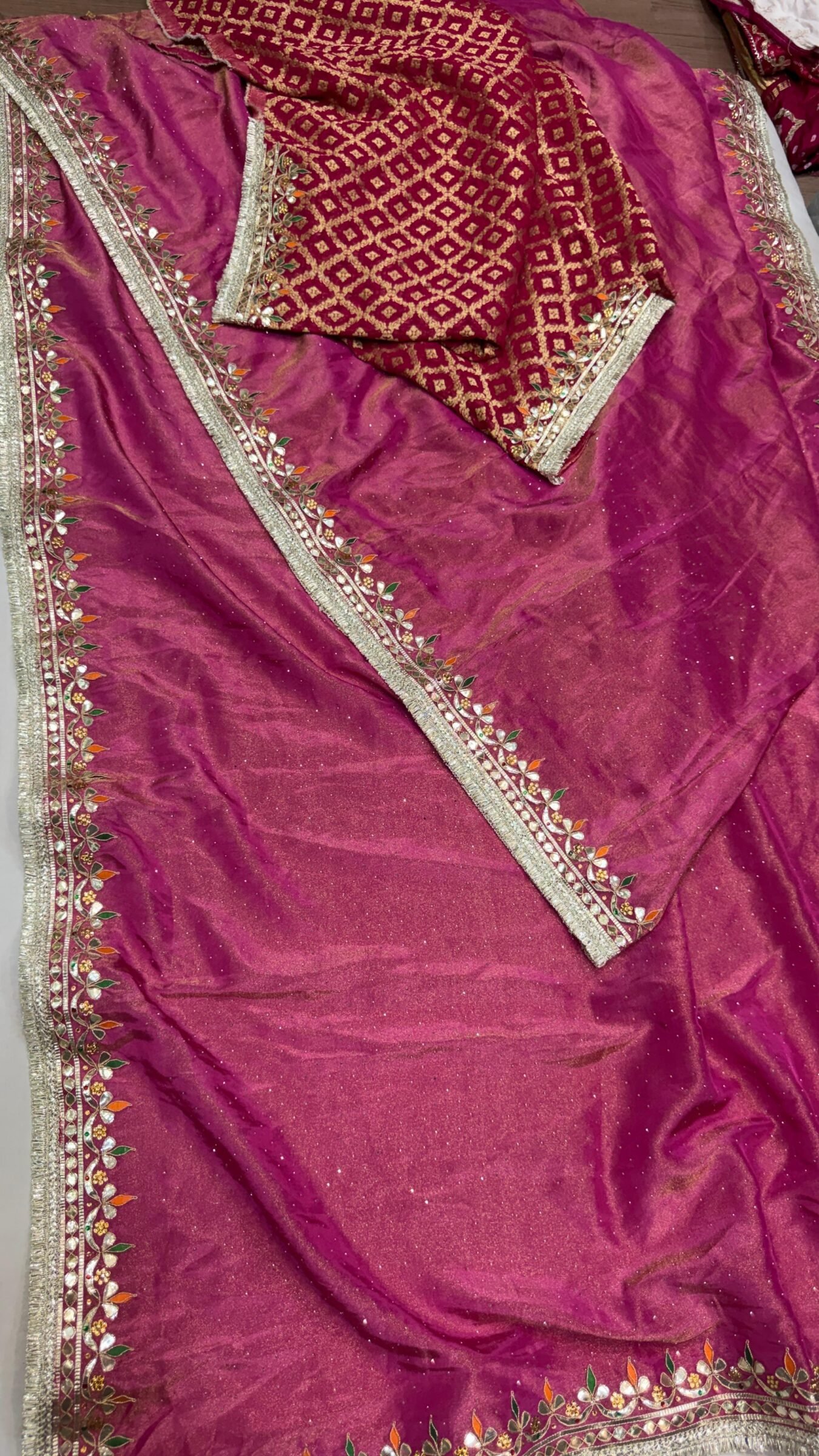 Pure Tissue Cosmos Silk Gota Patti Saree 2 A beautiful purple Pure Tissue Cosmos Silk saree with heavy gold Gota Patti work and a traditional Kiran border.