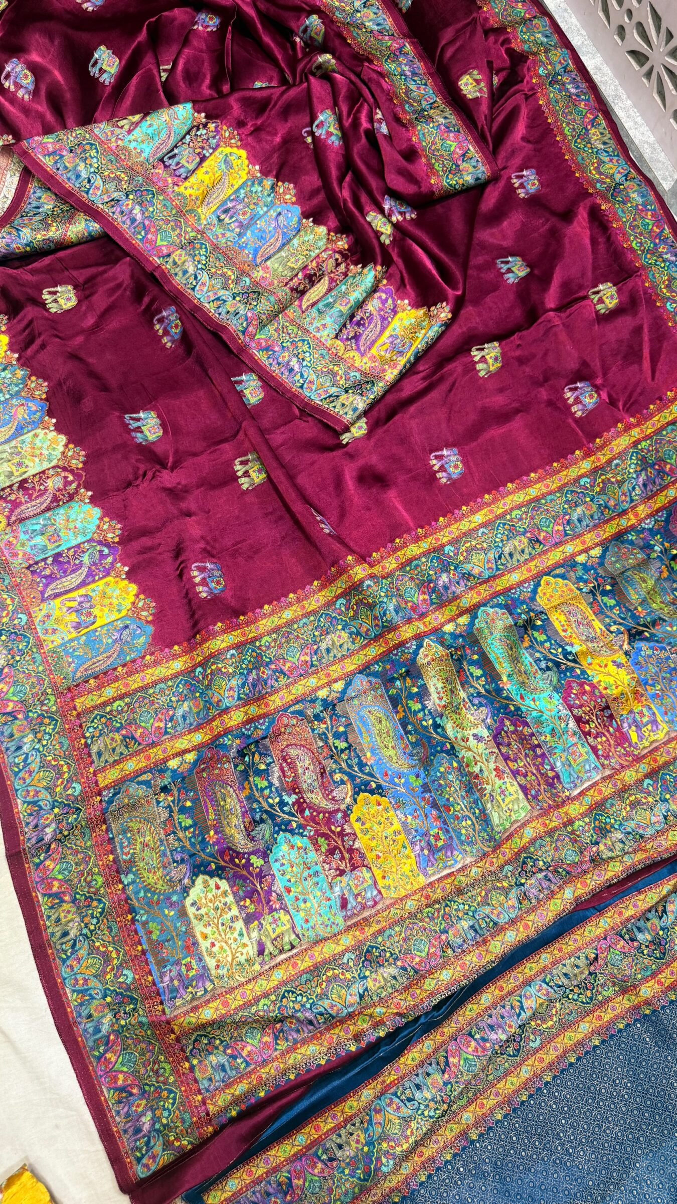 Royal Raj Darbari Tissue Silk Saree with Zari Work 2 A beautiful teal tissue silk saree featuring intricate golden zari work, traditional raj darbari motifs, and a matching embroidered blouse.