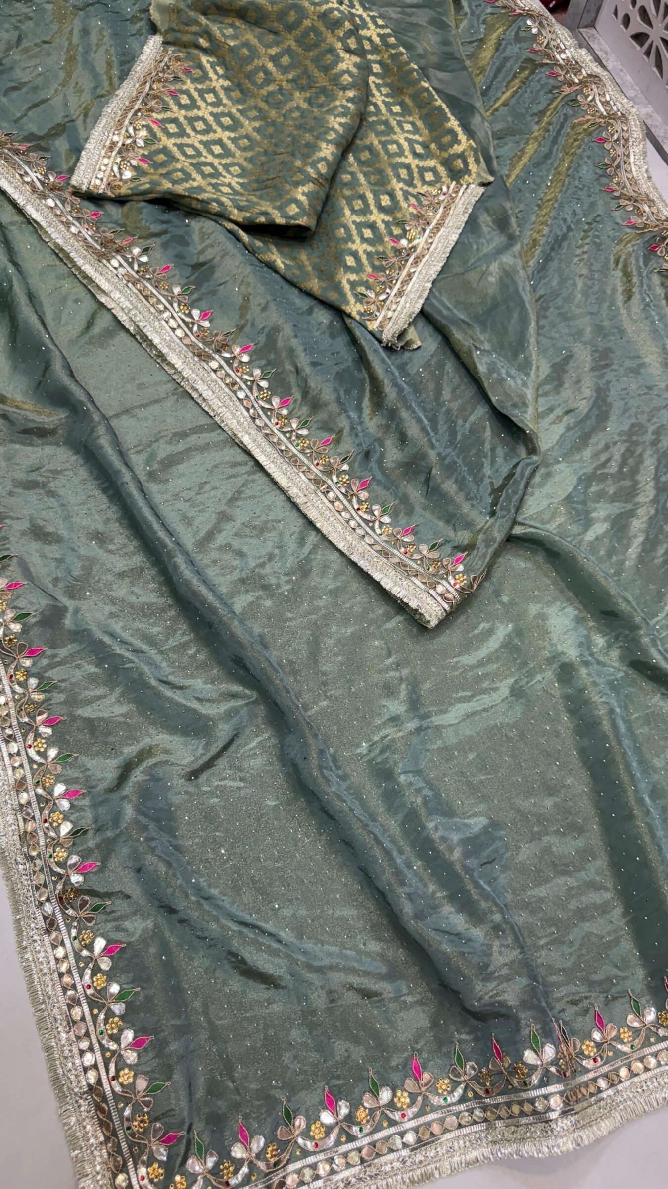 Pure Tissue Cosmos Silk Gota Patti Saree 3 A beautiful purple Pure Tissue Cosmos Silk saree with heavy gold Gota Patti work and a traditional Kiran border.