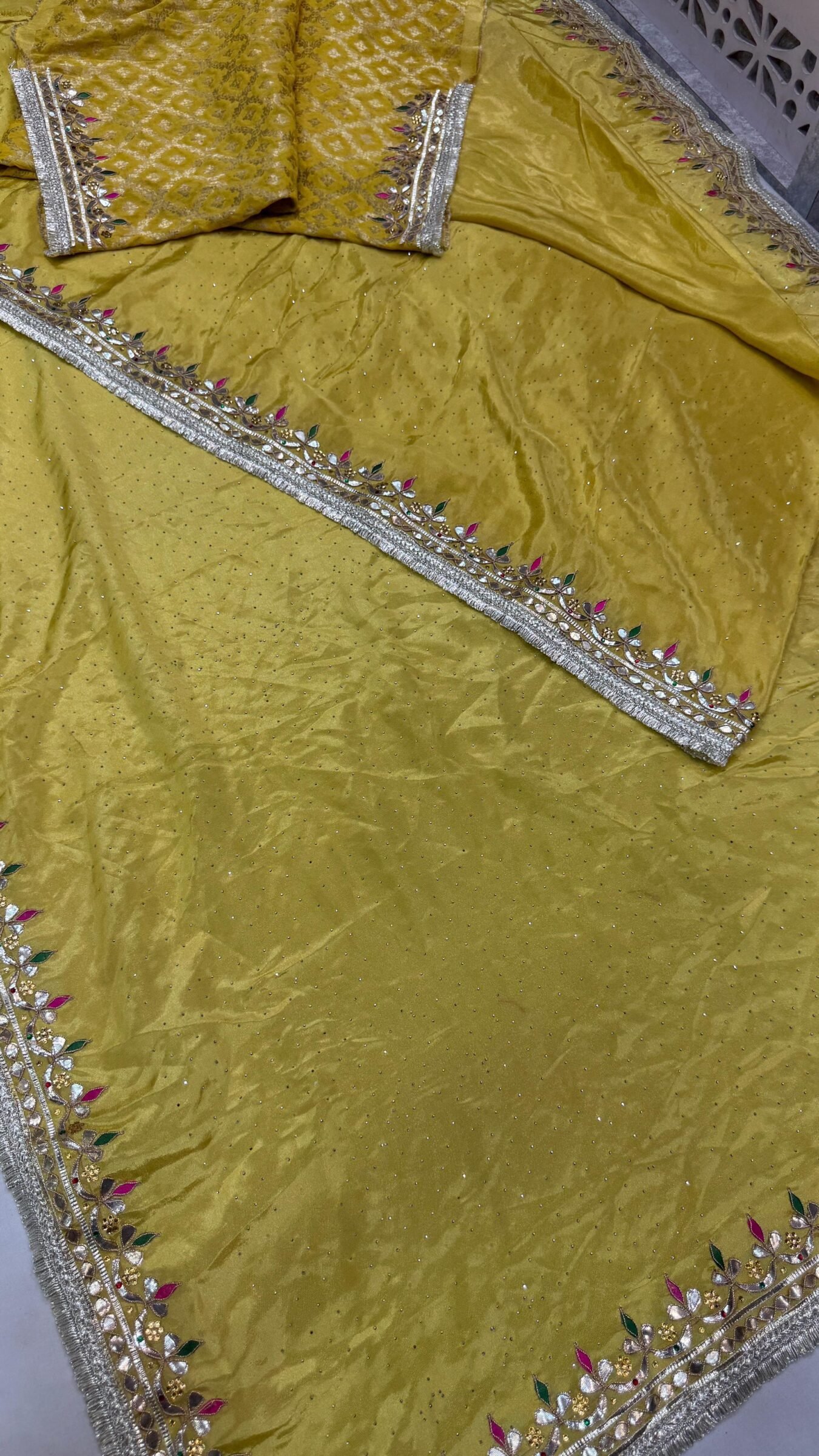 Pure Tissue Cosmos Silk Gota Patti Saree 4 A beautiful purple Pure Tissue Cosmos Silk saree with heavy gold Gota Patti work and a traditional Kiran border.