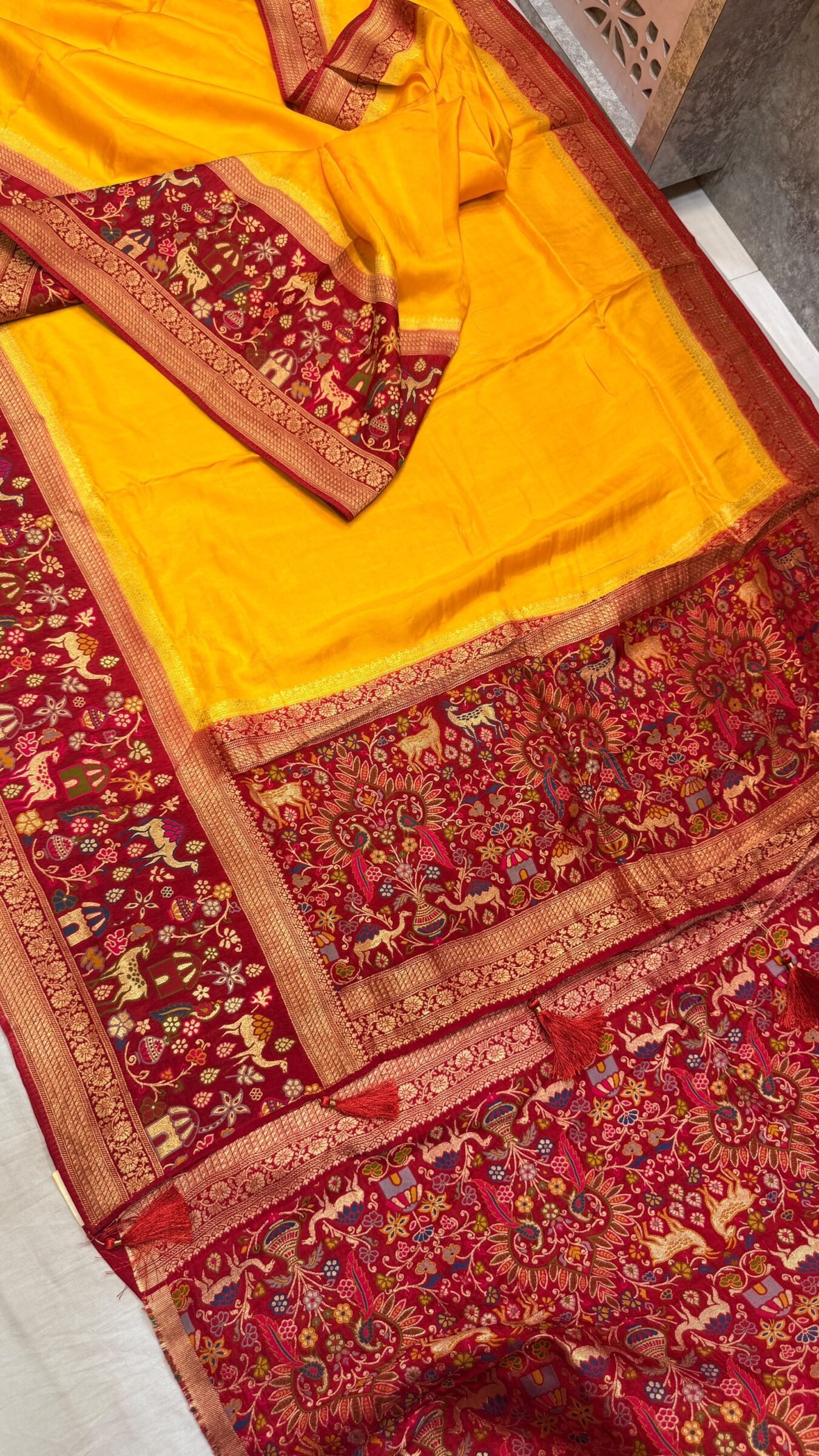 Royal Raj Darbari Tissue Silk Saree with Zari Work 5 A beautiful teal tissue silk saree featuring intricate golden zari work, traditional raj darbari motifs, and a matching embroidered blouse.