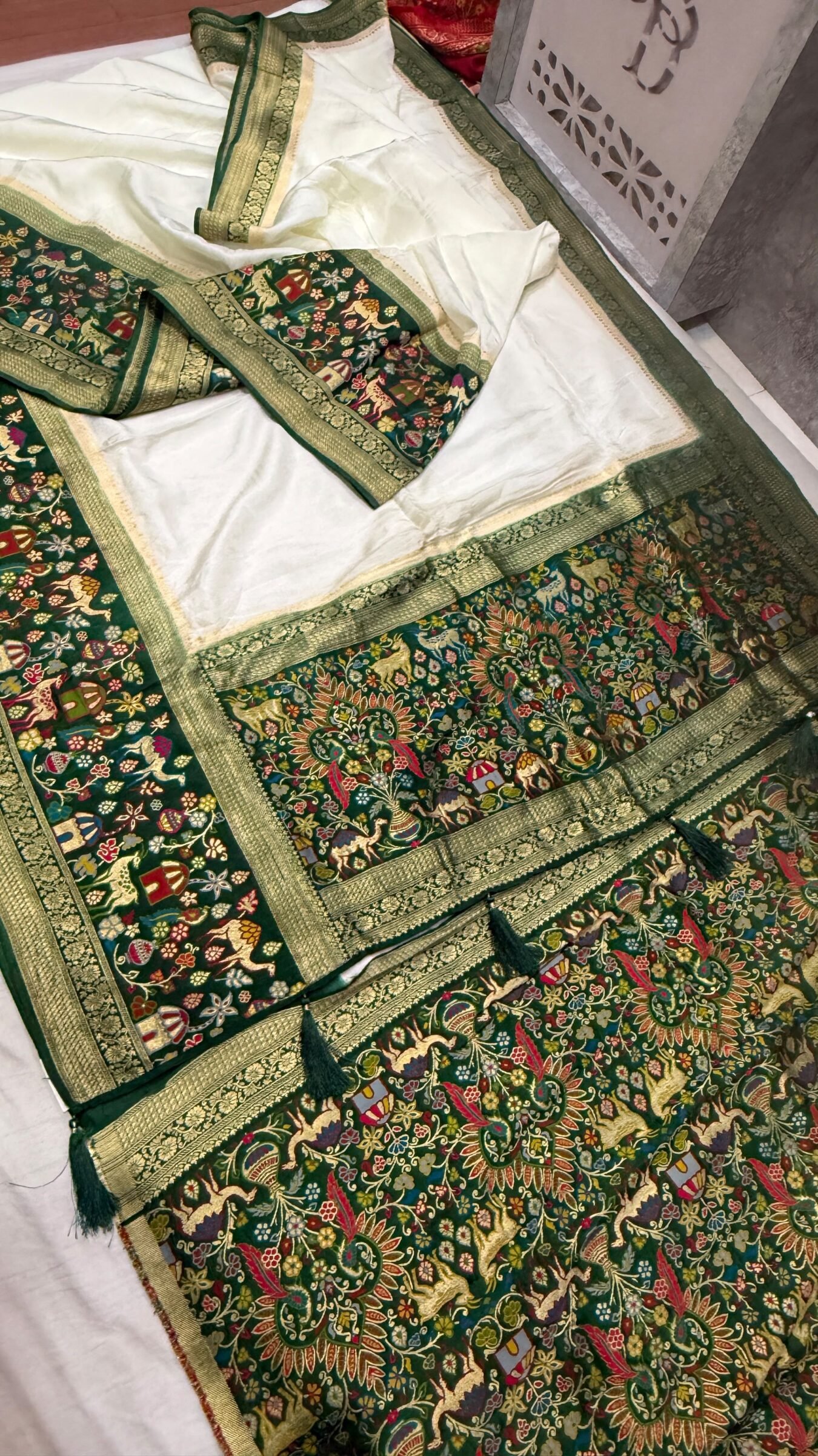 Royal Raj Darbari Tissue Silk Saree with Zari Work 8 A beautiful teal tissue silk saree featuring intricate golden zari work, traditional raj darbari motifs, and a matching embroidered blouse.