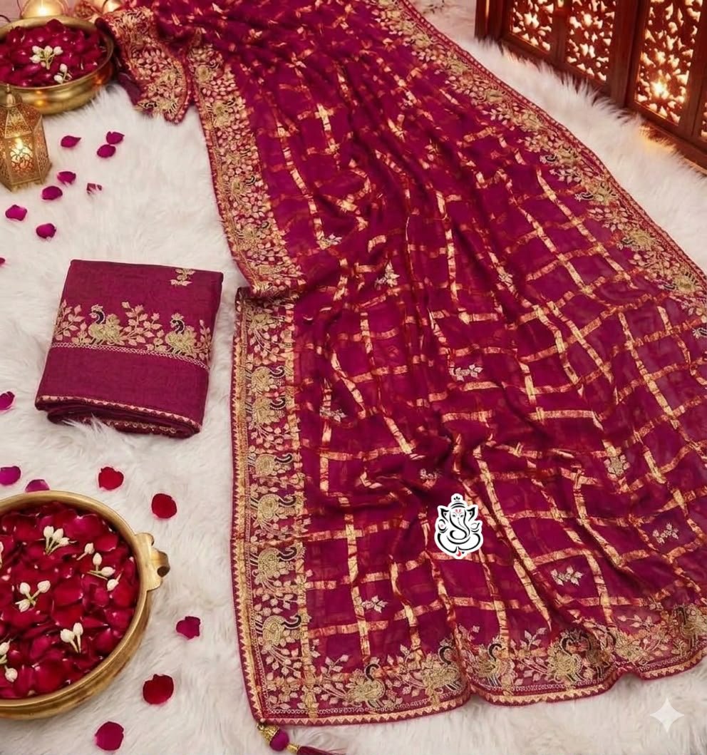 Soft Viscos Silk Saree with Traditional Pittawork 5 A woman in a red silk saree with pittawork poses while looking through a sieve during a festive occasion.