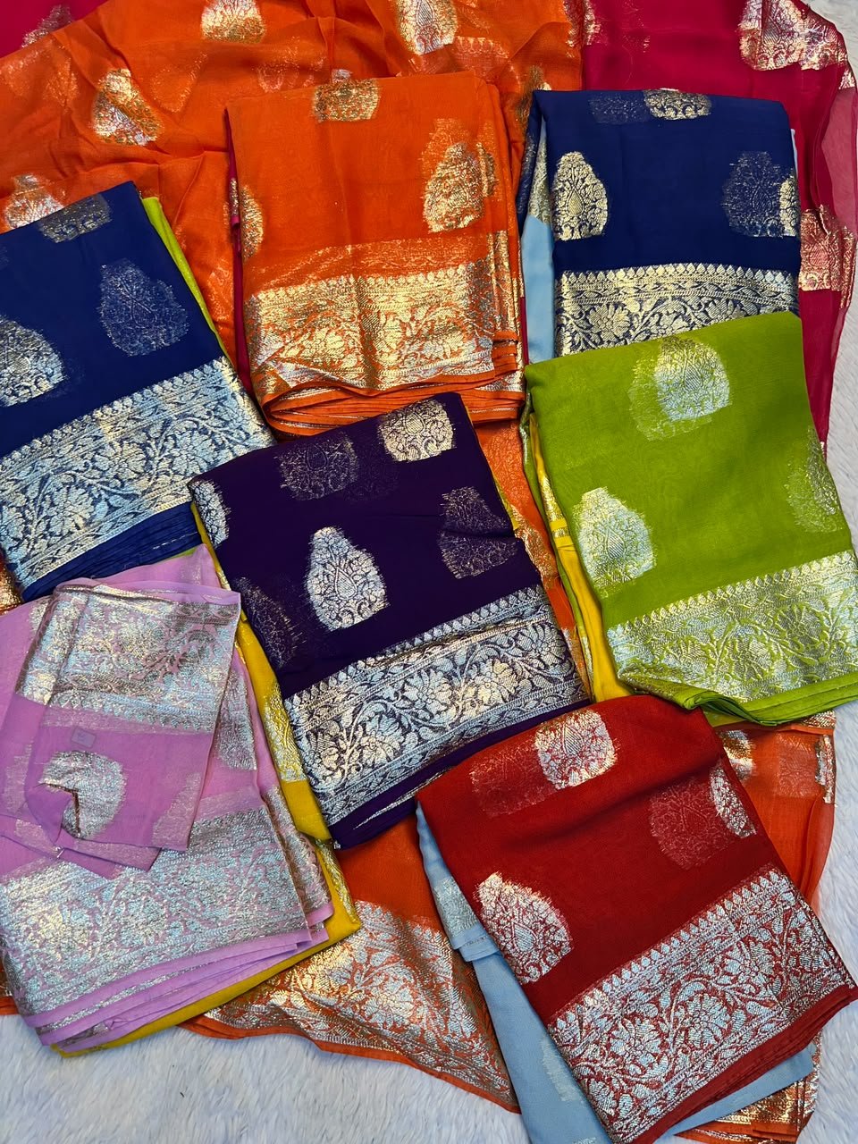 Viscose Georgette Saree With Zari Work for Karwachauth 1 A beautiful collection of Viscose Georgette sarees featuring vibrant colours and traditional gold Zari work borders.
