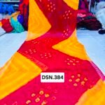 A person holding up a vibrant art silk Bandhani saree with geometric patterns and bright tie-dye work.