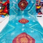 An Art Silk Bandhani saree displayed in yellow with prominent maroon circular Bandhej motifs.
