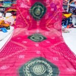 An Art Silk Bandhani saree displayed in yellow with prominent maroon circular Bandhej motifs.