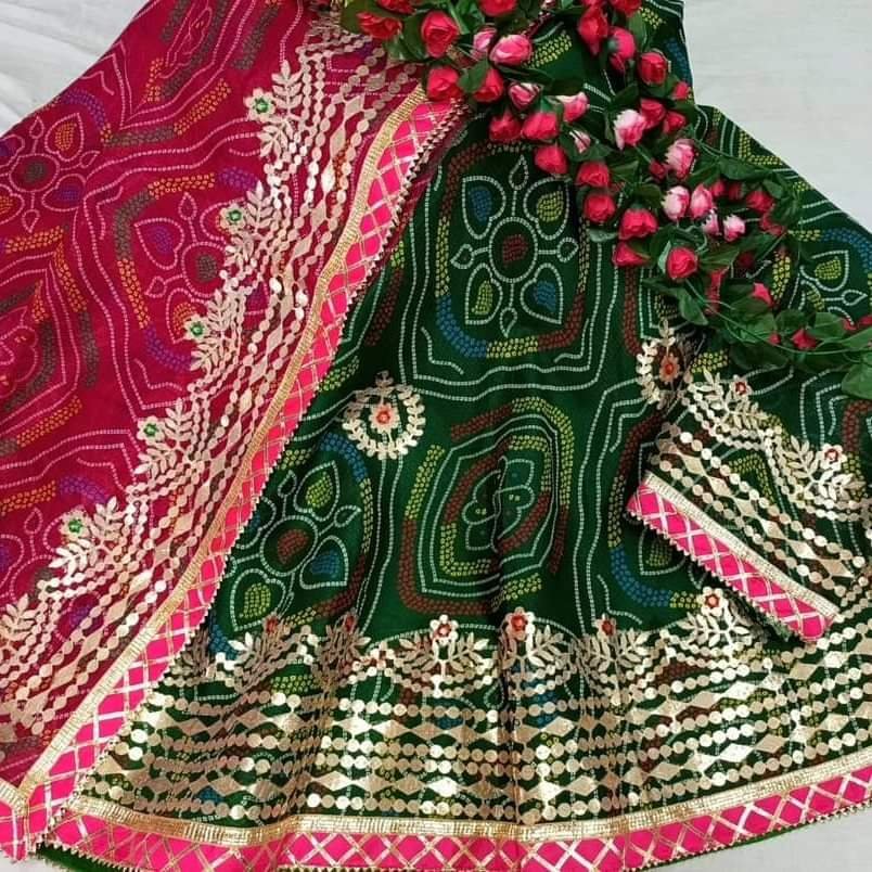 Bandhani Lehenga, Kota Doria Bandhani Lehenga with Gota Patti 10 A red and yellow Bandhani lehenga with Gota Patti work displayed on a mannequin.