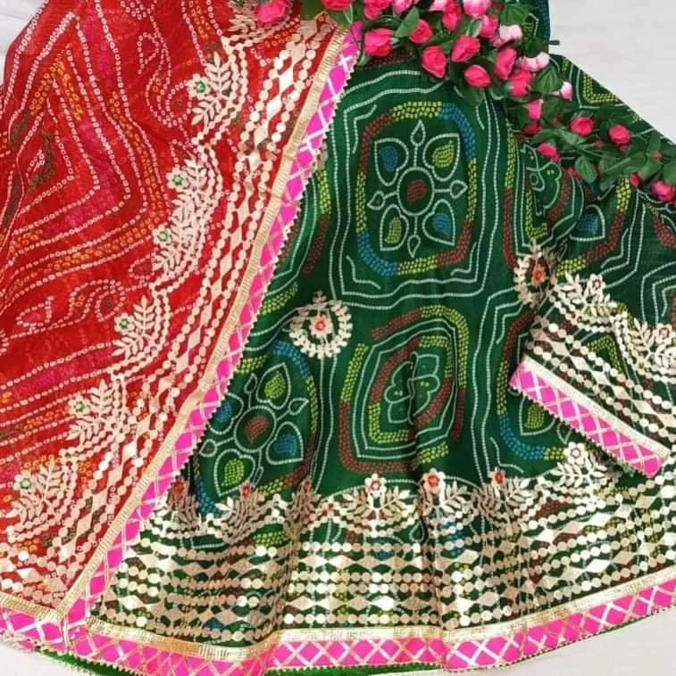 Bandhani Lehenga, Kota Doria Bandhani Lehenga with Gota Patti 8 A red and yellow Bandhani lehenga with Gota Patti work displayed on a mannequin.