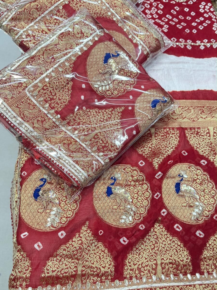 A vibrant red Bandhej georgette saree featuring detailed gold Gota Patti peacock motifs and borders.