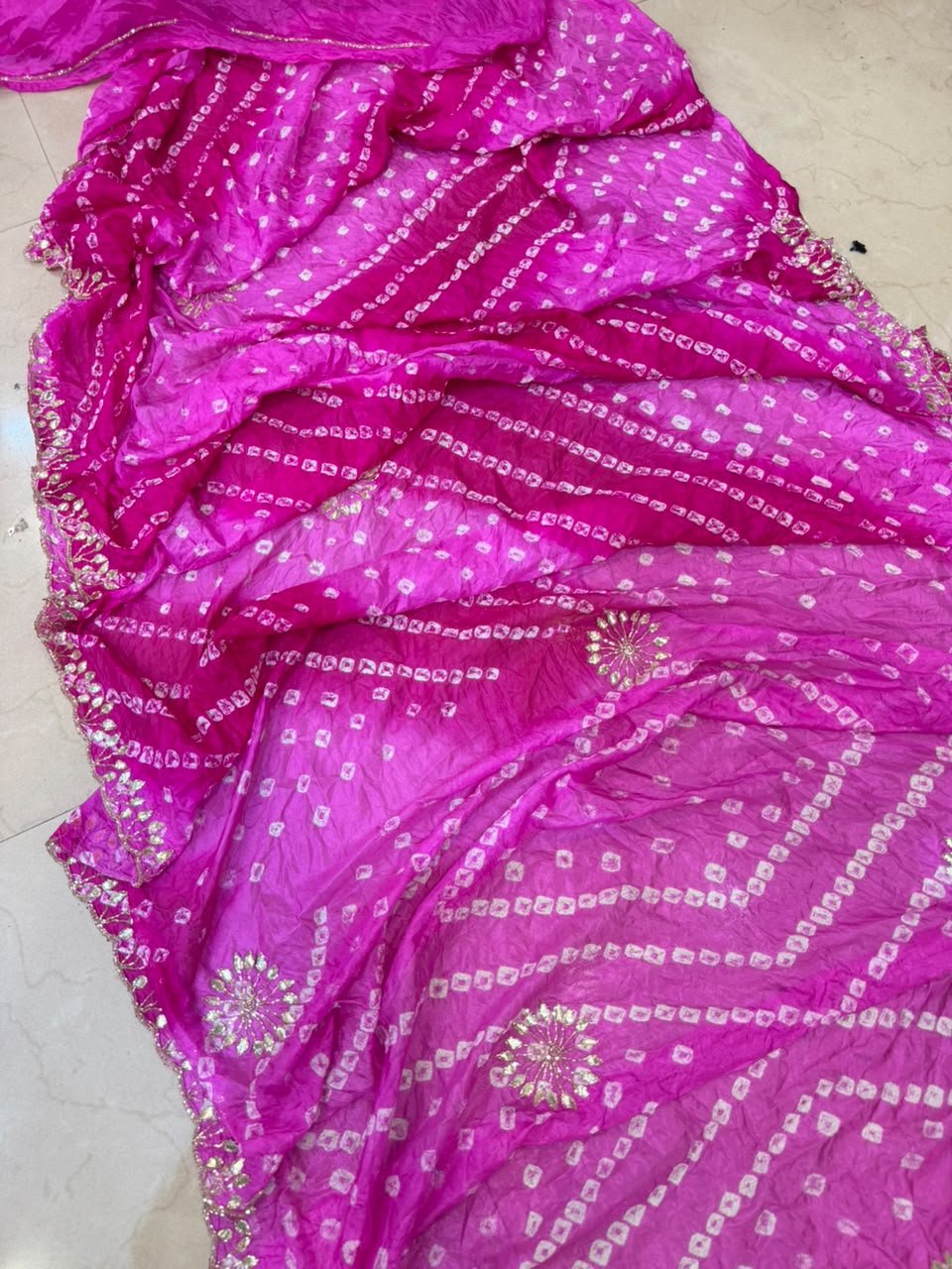 Semi Silk Bandhej Saree with Gota Patti and Katdana Work 2 A beautiful semi silk Bandhej saree in shades of green and blue, featuring intricate Gota Patti and Katdana handwork throughout the fabric.