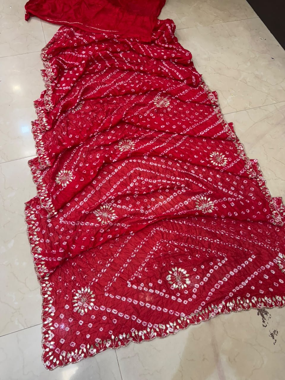 Semi Silk Bandhej Saree with Gota Patti and Katdana Work 5 A beautiful semi silk Bandhej saree in shades of green and blue, featuring intricate Gota Patti and Katdana handwork throughout the fabric.