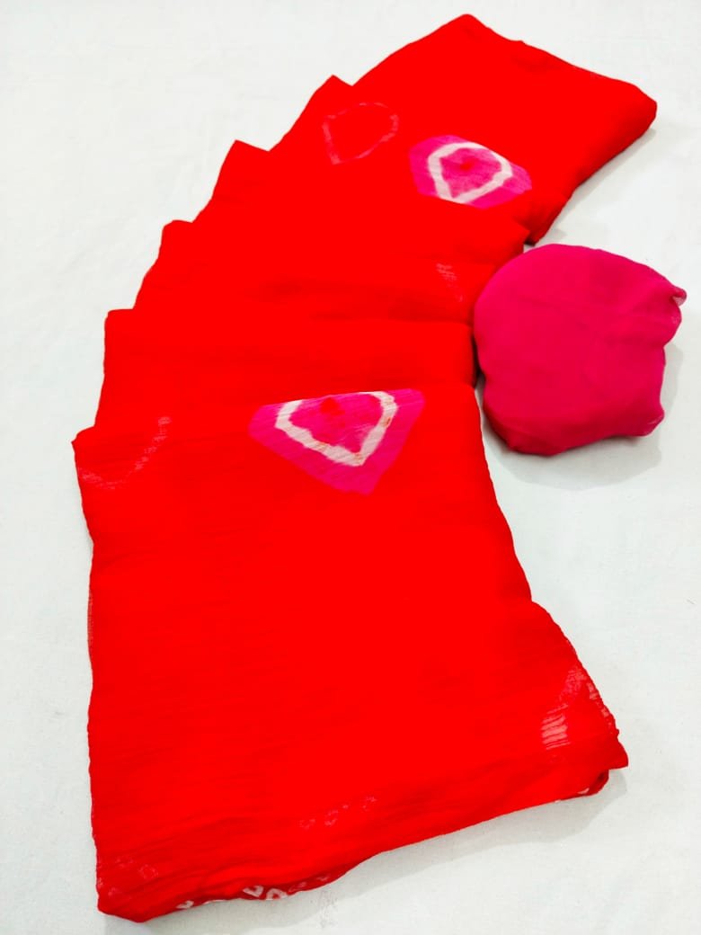 New Arrivals 51 A vibrant red Nazneen chiffon Bandhani saree displayed with a matching pink blouse piece.
