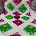 A beautiful half pure chiffon saree with green and magenta diamond patterns and intricate silver gota patti embroidery.