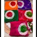 A collection of five colorful chiffon sarees with Ladoo print circles and handwork details.