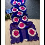 A collection of five colorful chiffon sarees with Ladoo print circles and handwork details.