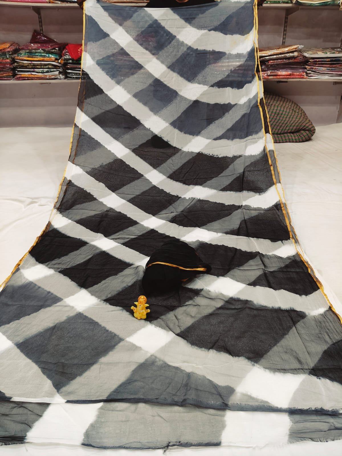 Dhamaka Offer: Beautiful Najmeen Chiffon Leheriya Saree 3 A beautiful blue and white double color Leheriya saree made of najmeen chiffon fabric with a gold piping border.