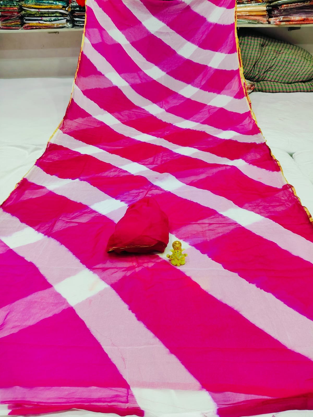 Dhamaka Offer: Beautiful Najmeen Chiffon Leheriya Saree 5 A beautiful blue and white double color Leheriya saree made of najmeen chiffon fabric with a gold piping border.