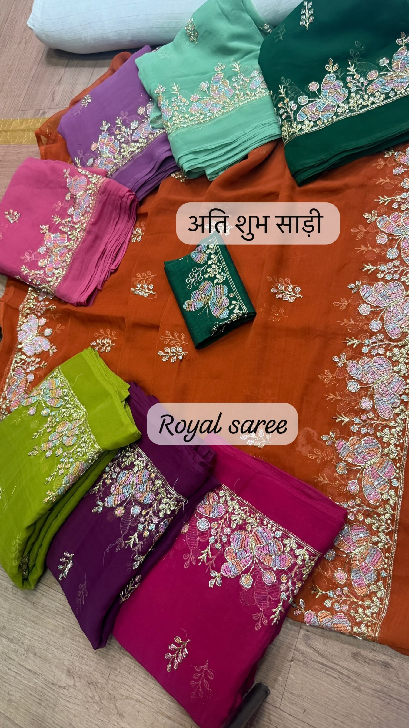 Royal Georgette Darbari Saree with Kardana Work 1 A beautiful collection of Royal Georgette Darbari sarees in various vibrant colors, featuring detailed butterfly kardana work and elegant borders.