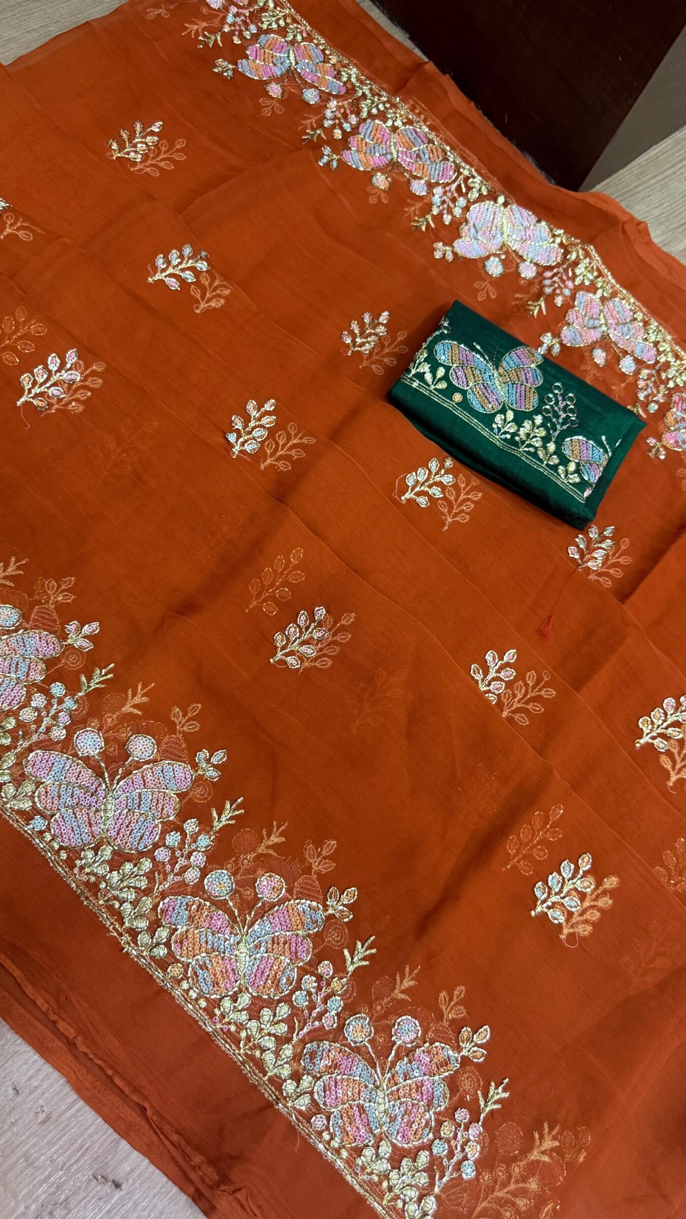 Royal Georgette Darbari Saree with Kardana Work 2 A beautiful collection of Royal Georgette Darbari sarees in various vibrant colors, featuring detailed butterfly kardana work and elegant borders.