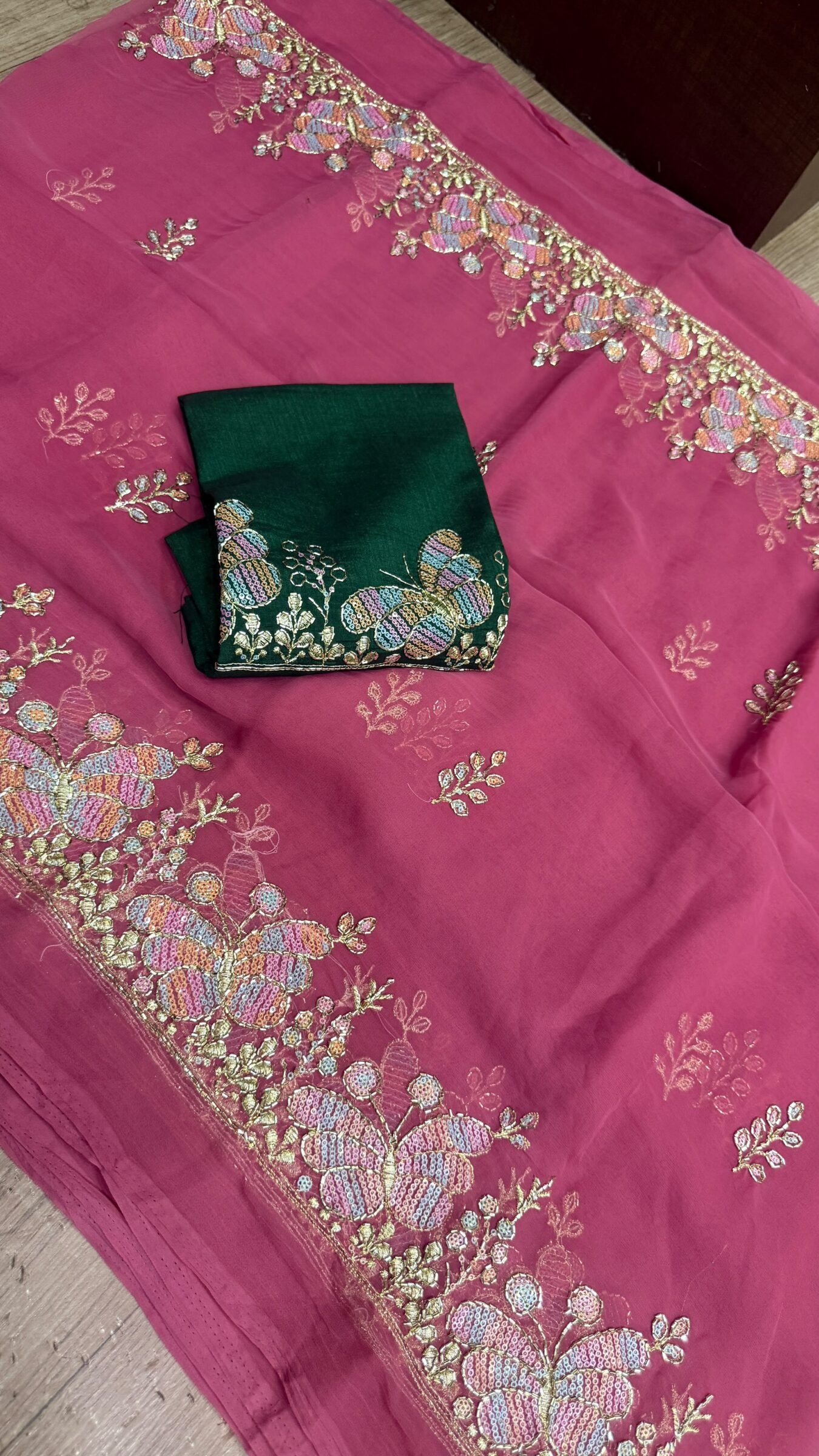 Royal Georgette Darbari Saree with Kardana Work 8 A beautiful collection of Royal Georgette Darbari sarees in various vibrant colors, featuring detailed butterfly kardana work and elegant borders.