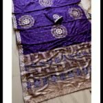 Four folded Dola Viscose Bandhej sarees in vibrant colours featuring intricate Gota Patti borders and rich weaving.