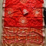 Four folded Dola Viscose Bandhej sarees in vibrant colours featuring intricate Gota Patti borders and rich weaving.