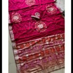 Four folded Dola Viscose Bandhej sarees in vibrant colours featuring intricate Gota Patti borders and rich weaving.