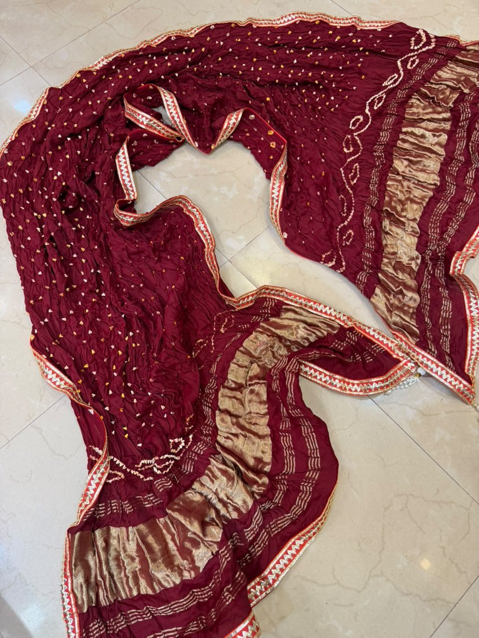 Bandhej Dupatta, Pure Gajji Silk Handwork Dupatta 3 Three colorful Bandhej dupattas with Gota Patti borders and tassels displayed on a light surface.