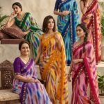 A beautiful collection of multicolored georgette sarees with dabka gota patti work displayed on a table.